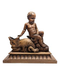 Sculpture en bois d'un bébé adossé à un animal XIXème