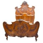 Exceptionnel lit baroque de style Louis XV en noyer sculpté aux bébés
